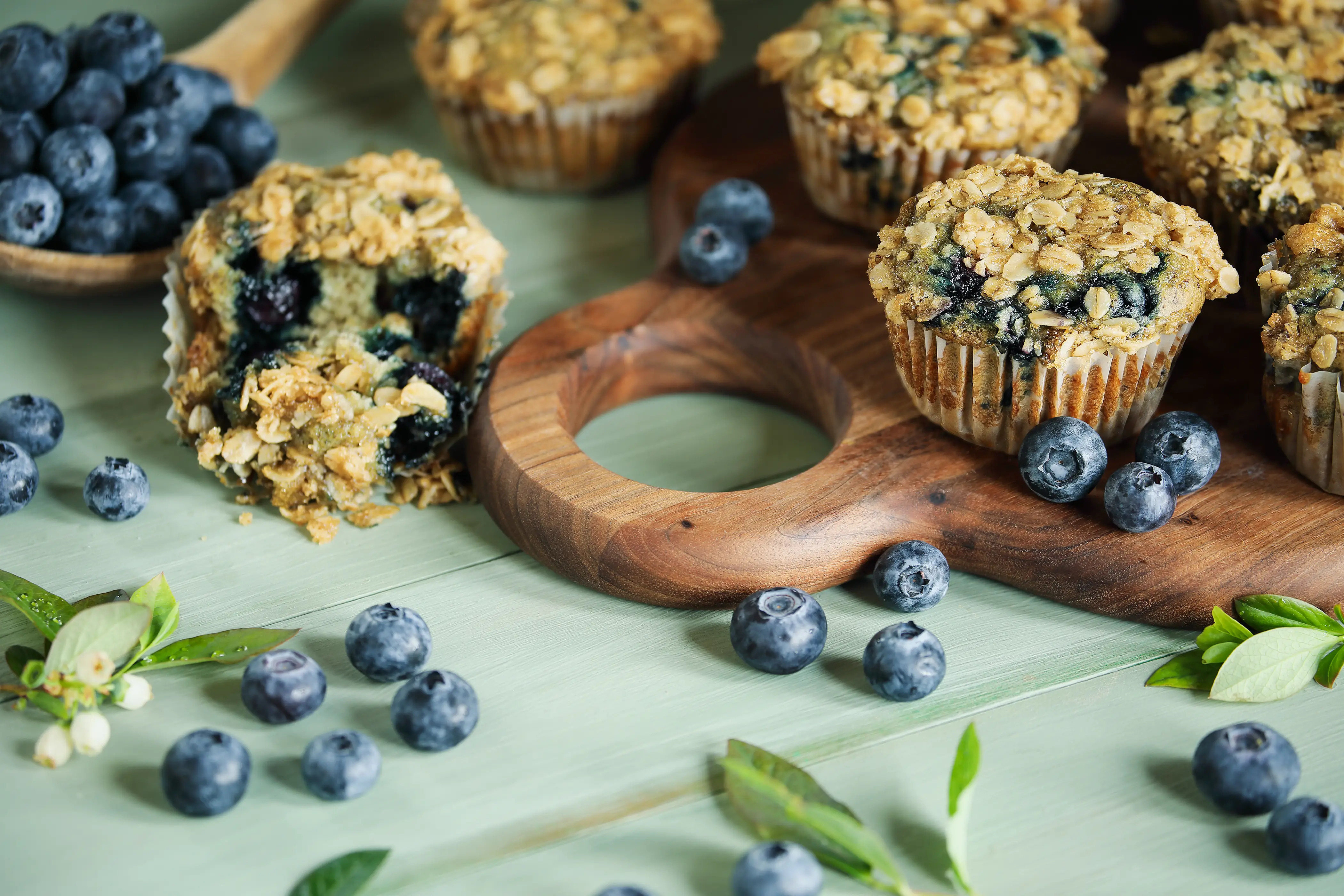 muffins with blueberries on a wooden board