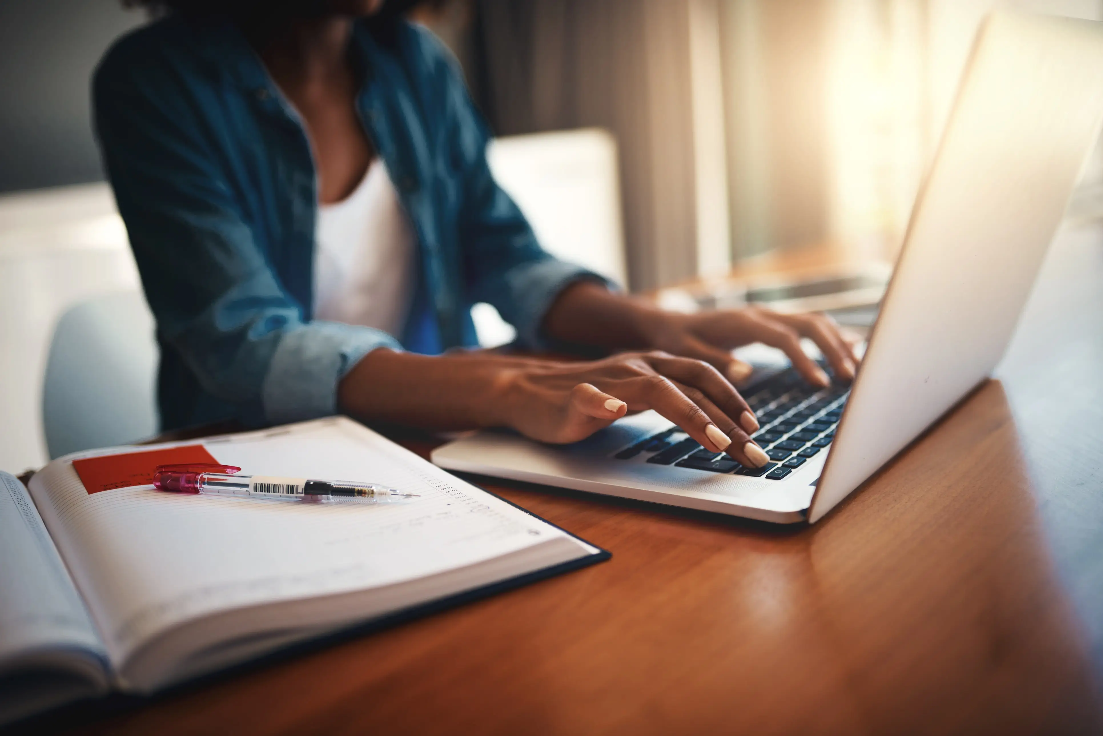 a person typing on a laptop