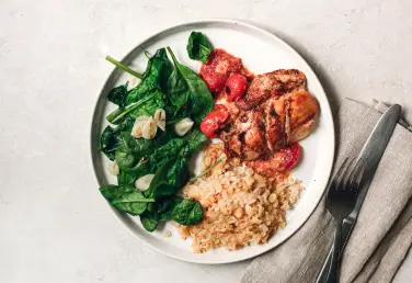 a plate of food with a fork and knife