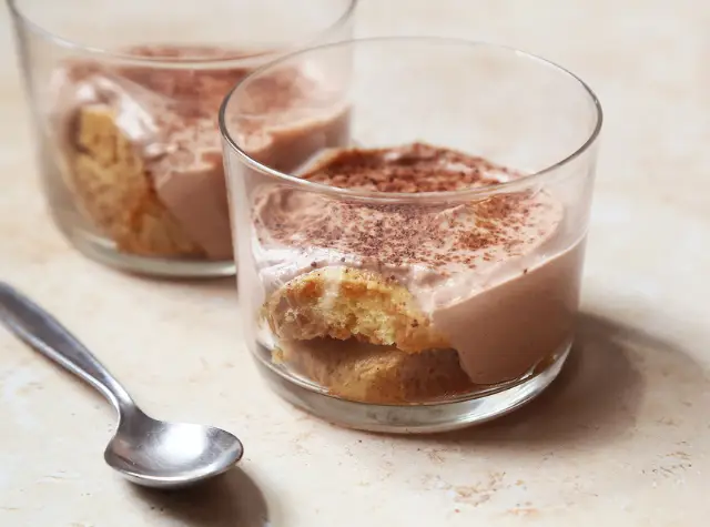 a dessert in a glass cup