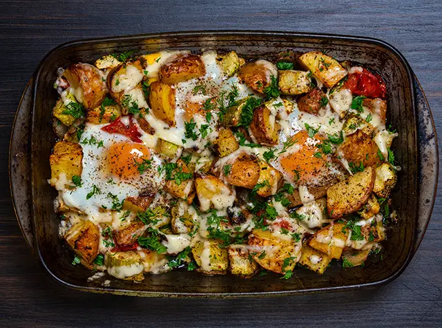 a pan of food with eggs and potatoes