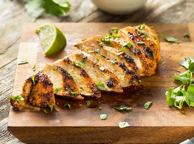 a sliced chicken on a cutting board