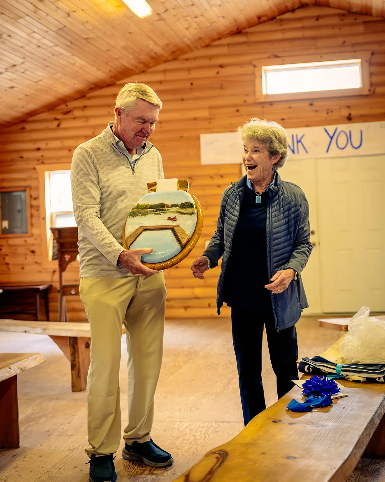a man and woman holding a round object