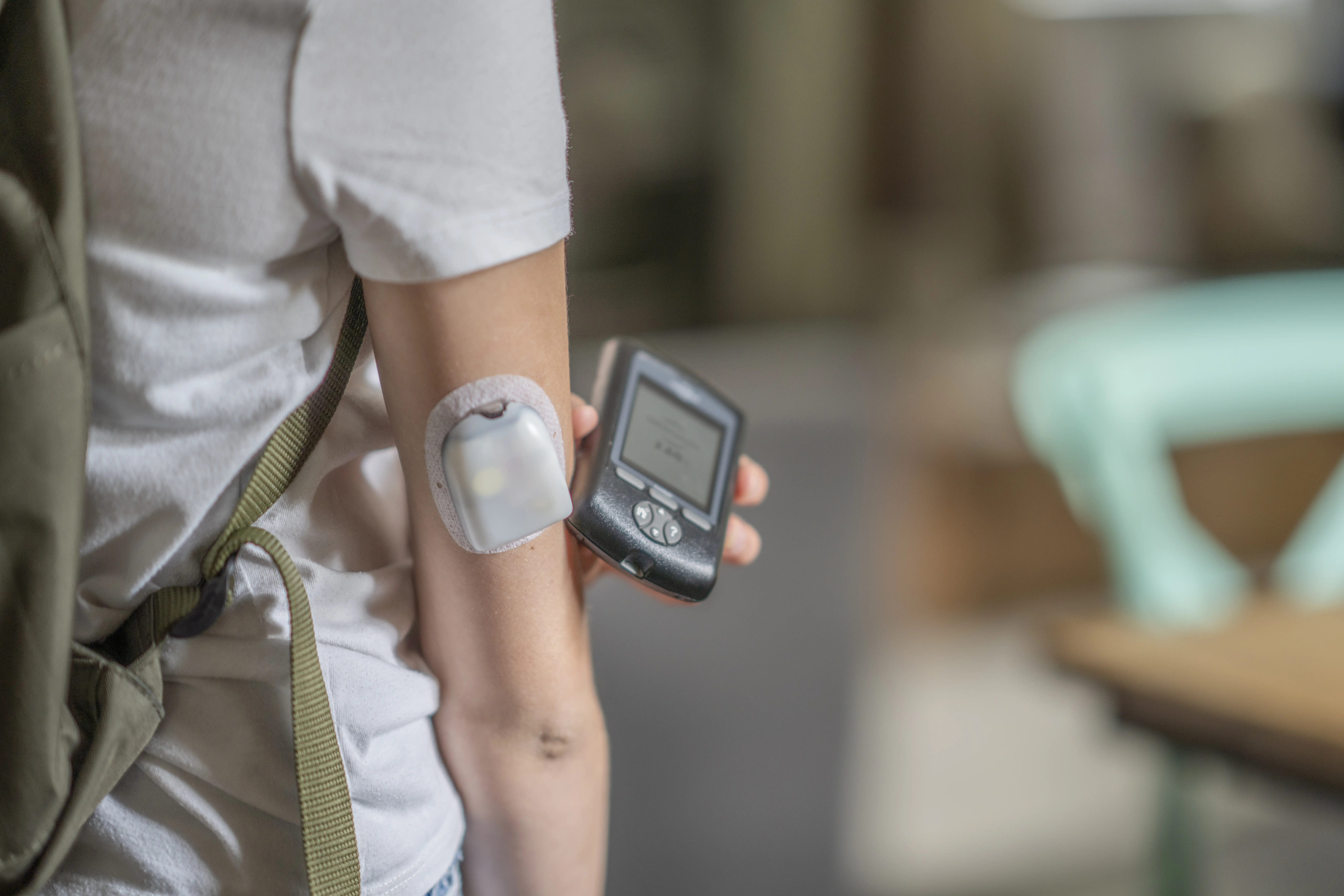 a person with an electronic device on their arm