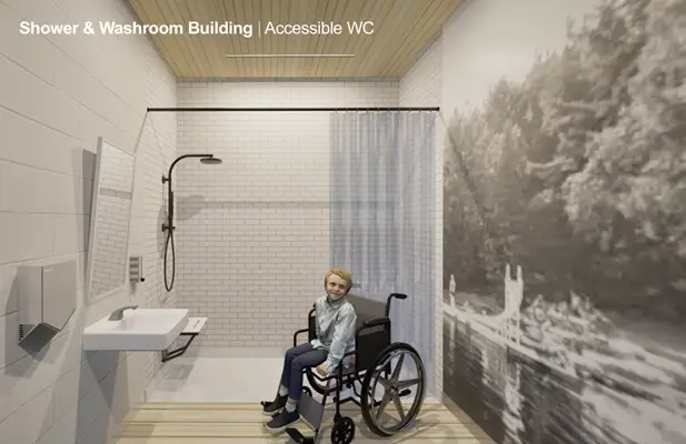 a person sitting in a wheelchair in a bathroom